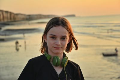 Portrait of girl at beach during sunset