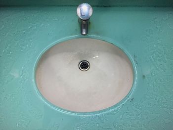 Close-up of faucet in bathroom