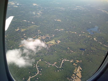 Aerial view of landscape seen through airplane window