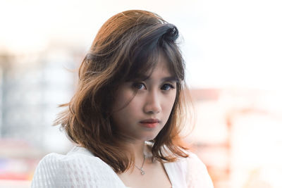 Close-up of young woman looking away