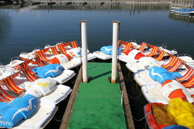 High angle view of paddleboats moored at jetty