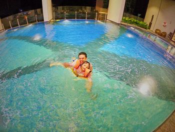 Man swimming in pool