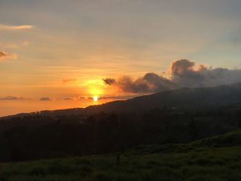 Scenic view of landscape against sky during sunset