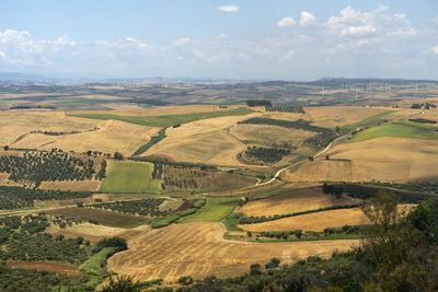 Aerial view of agricultural field against sky