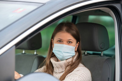 Portrait of woman in car