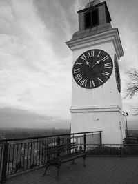 Low angle view of clock tower against building