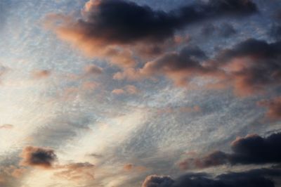 Low angle view of clouds in sky during sunset