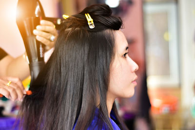 Side view of woman in salon