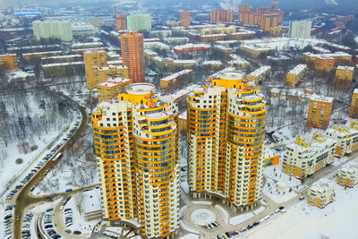 High angle view of illuminated buildings in city