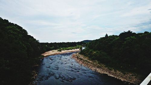 Scenic view of landscape against cloudy sky