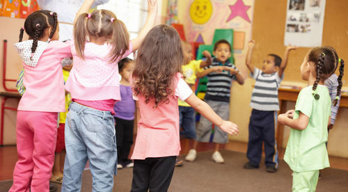 Girls and boys in classroom