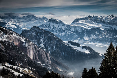 Scenic view of snowcapped mountains against sky