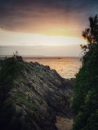 Scenic view of sea against sky at sunset