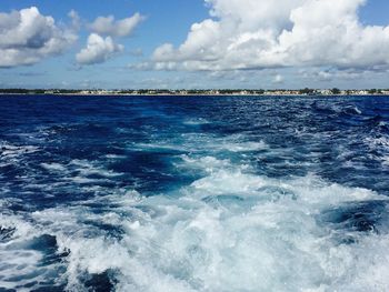 Scenic view of sea against cloudy sky