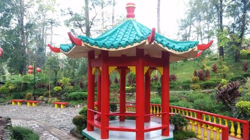 Red structure against trees