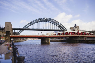 The lower swing bridge in front of the high bridge over the river tyne in newcastle