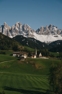 Scenic view of field and mountains against sky