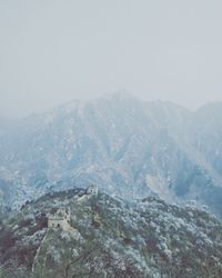 Scenic view of mountains against clear sky during winter