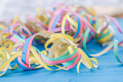 Close-up of multi colored umbrellas on table