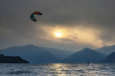 Kitesurfing scene at sunset on lake como