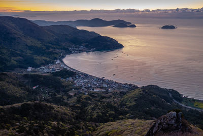 High angle view of beach against sky during sunset