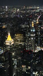 Illuminated buildings in city at night