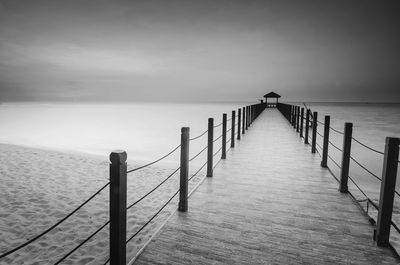 Old abandoned bridge over the sea