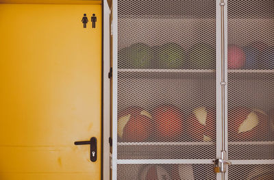 Closed door of yellow school gym