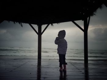 Woman standing on beach