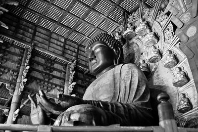 Low angle view of buddha statue in temple