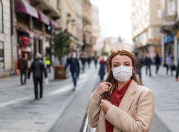 Portrait of woman on city street