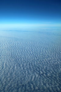 Scenic view of landscape against blue sky