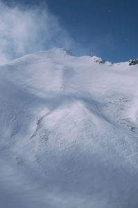 Scenic view of snowy landscape against sky