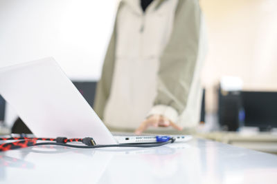 Man using laptop on table