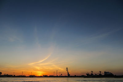 Silhouette of city at sunset