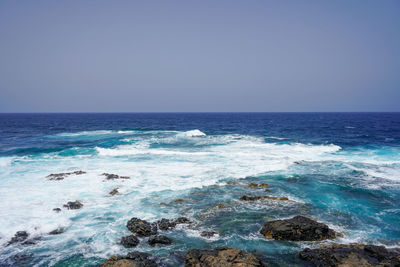 Scenic view of sea against clear sky