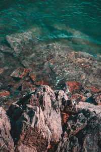 High angle view of rocks and sea
