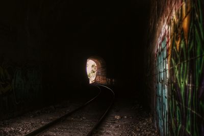 Railroad tracks in tunnel