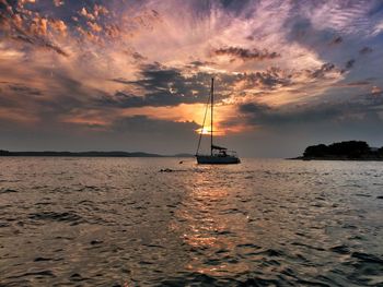 Scenic view of sea against dramatic sky