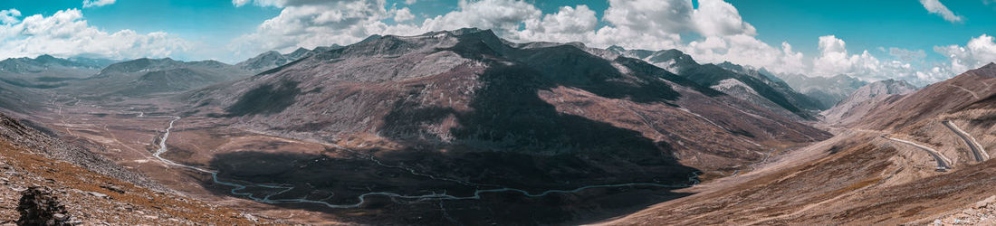 Panoramic view of landscape with mountain range in background