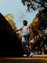 Full length of man standing on rock