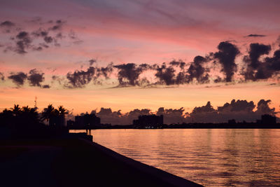 Scenic view of sea against romantic sky at sunset