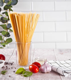 Italian pasta ingredients on kitchen table. food cooking