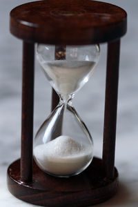 Close-up of hourglass on table