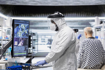 Rear view of woman using mobile phone