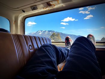 Low section of man sitting in bus