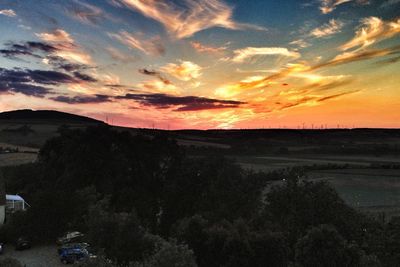 Scenic view of landscape against sky during sunset