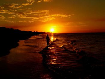 Scenic view of sea at sunset