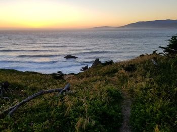 Scenic view of sea against sky during sunset