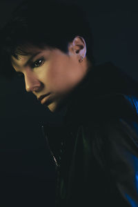 Close-up portrait of young man looking away